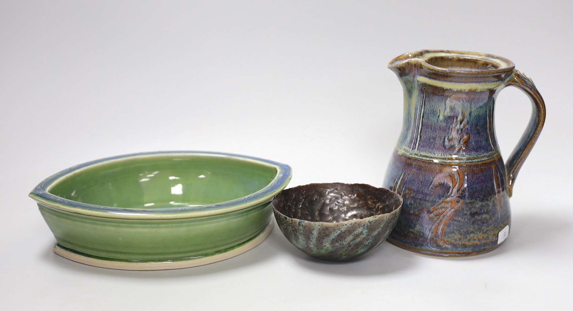 A Joe Finch (British b.1947) lustre jug, together with an Arwyn Jones eye shaped dish, and a Marcus Finch Raku bowl, tallest 16.5cm (3)